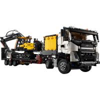 Nákladní auto Volvo FMX a elektrický bagr Volvo EC230